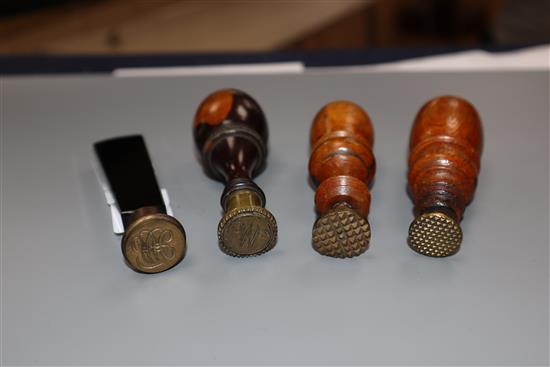 Three 19th century lignum vitae handled desk seals and a black glass handled seal